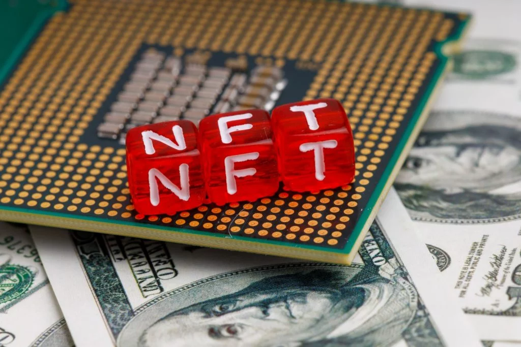 3 red dices, with letters forming the abbreviation NFT on top of a chip and moneys. NFTs Online Courses