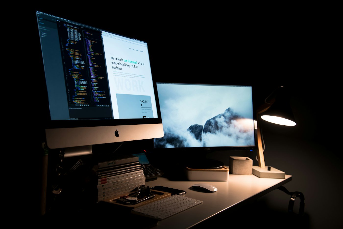 Course creator building an online course landing page layout with a wireframe visible on a laptop screen